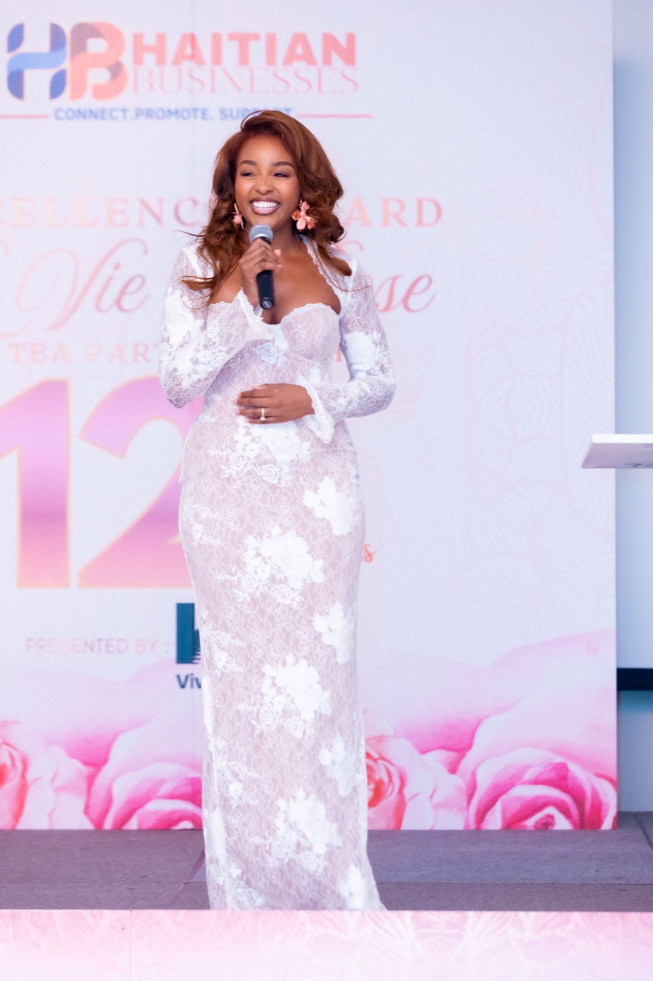 Pascale Belony hosting with microphone
